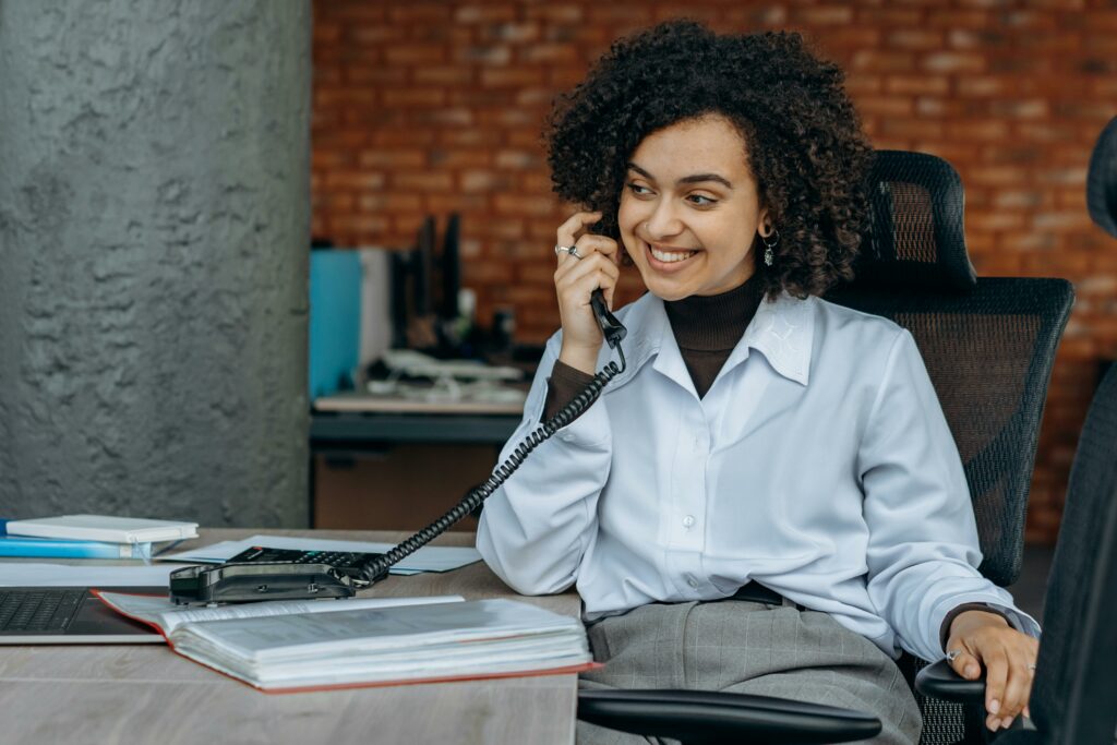 Front page women at desk on an office phone